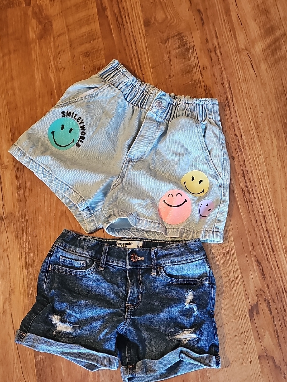 Abercrombie kids light blue denim shorts, H&M colorful smiley faces Shorts.
